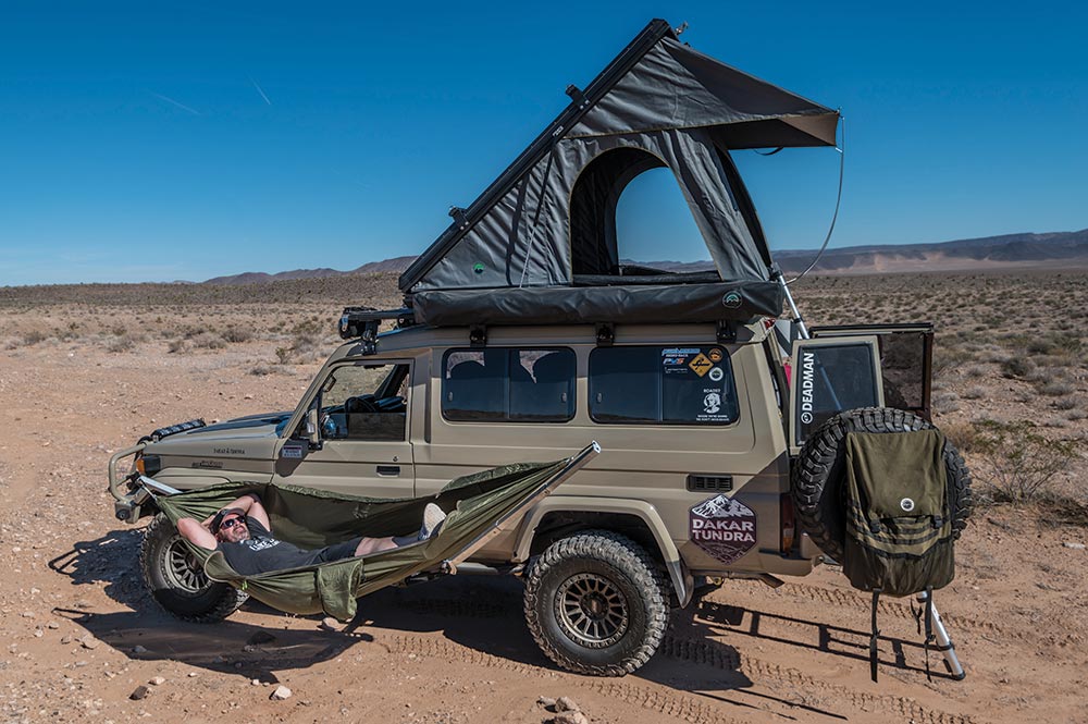 A hammock and roof top tent complete the Troopy camp setup.