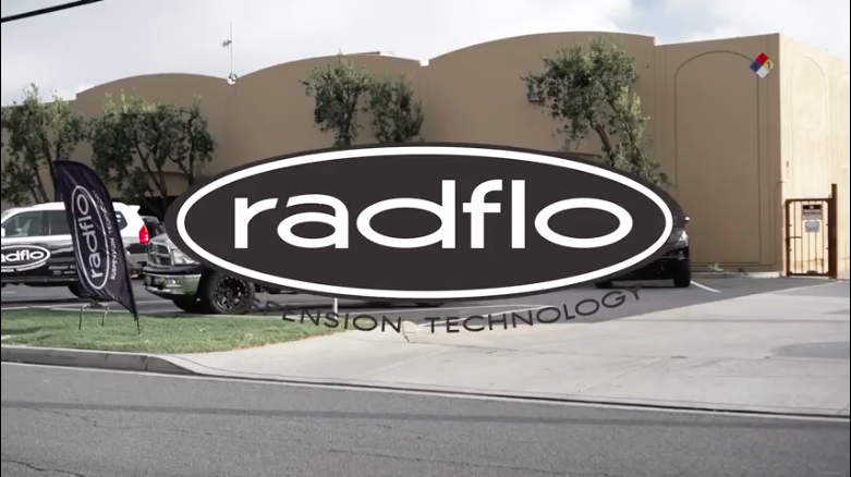 Radflo Suspension logo superimposed over an image of their shop.