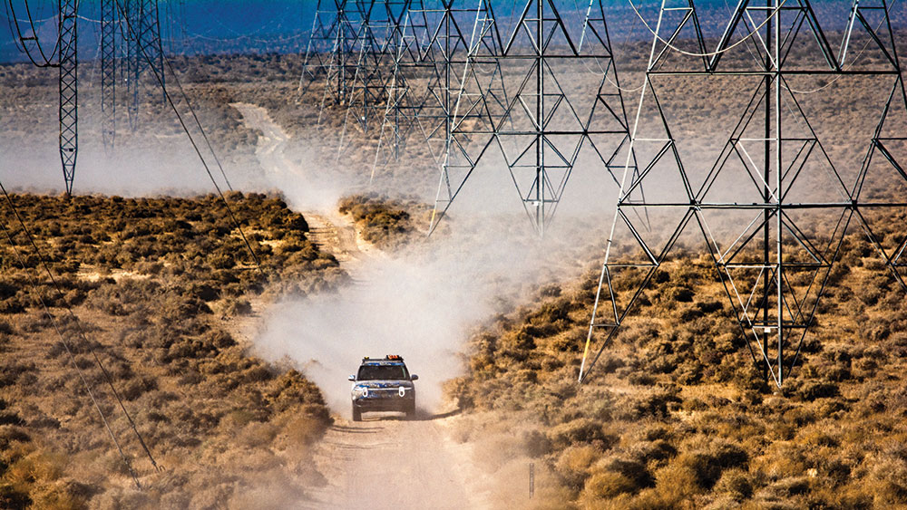 Rivian R1T EV off-roading through the desert.