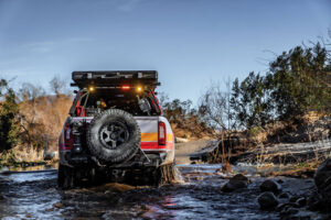 A Rig’d Supply Ultraswing tire carrier holds a Pro Eagle jack and allows for a fullsize spare