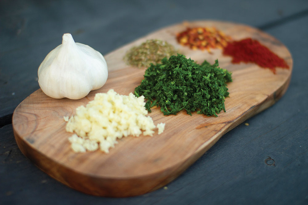 Ingredients for chimichurri recipe include herbs and garlic.