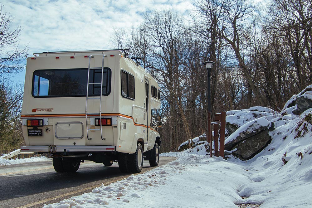 The ladder on the back of the camper completes its vintage look.