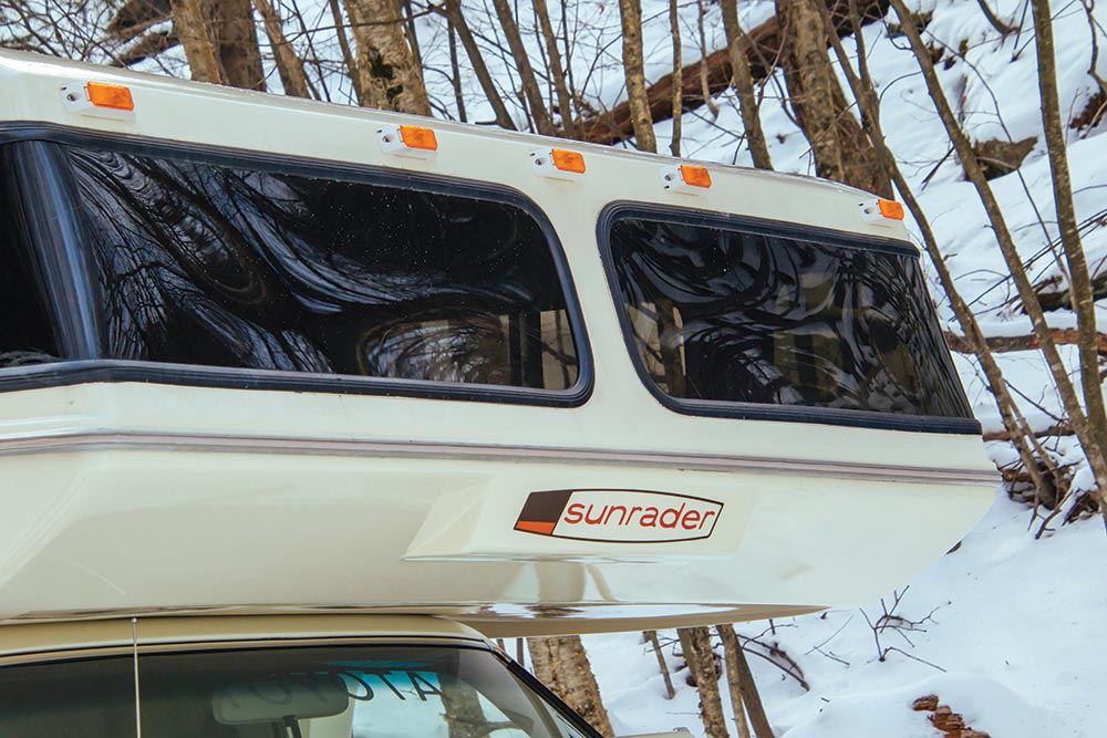 Two windows make room above the cab.