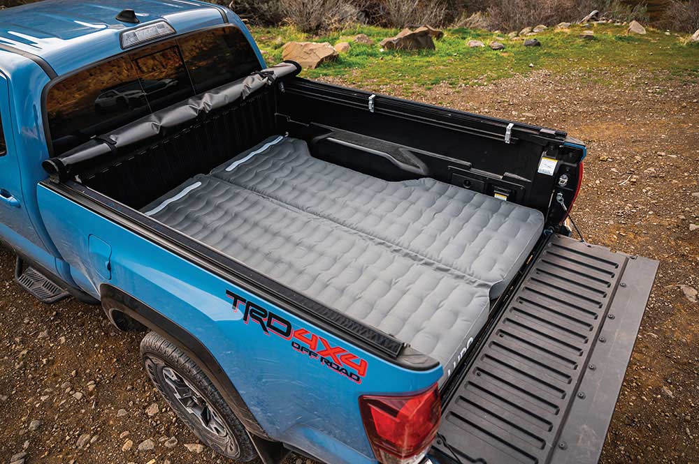Blue Tundra with air mattress in bed.