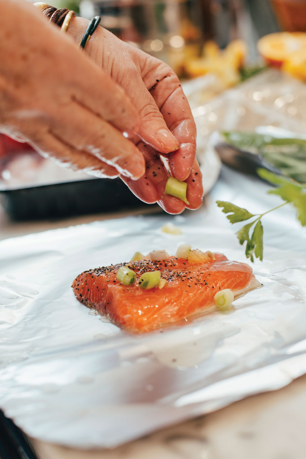 Fish in a foil packer prepares to hit the grill.