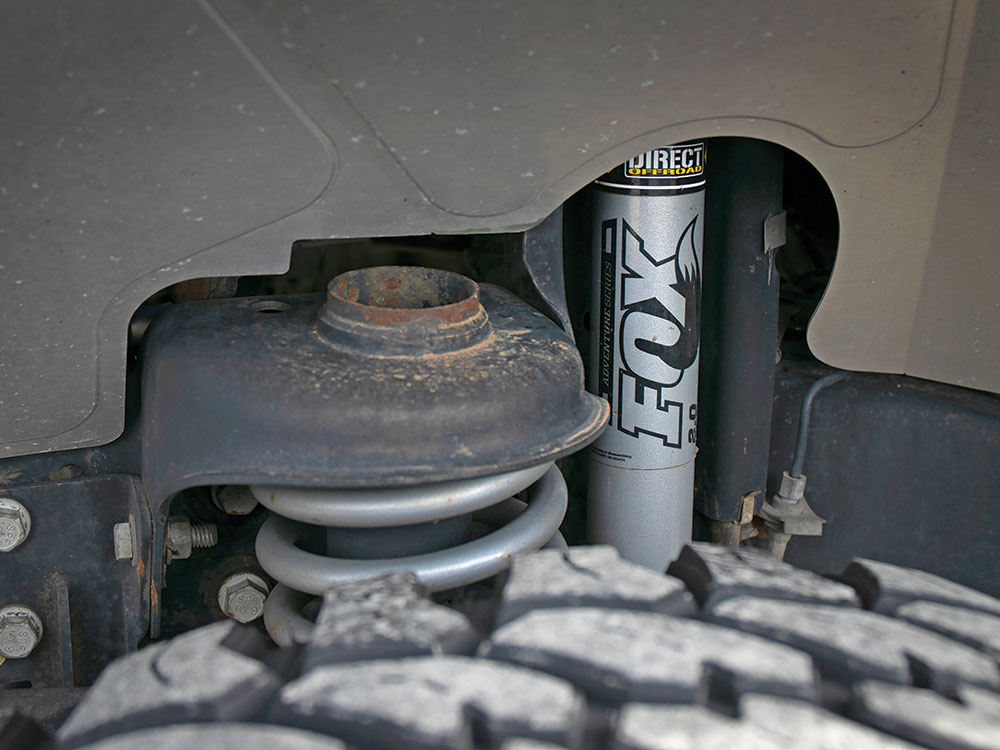 A glimpse over the tires reveals a Fox upgraded lift kit system on this vehicle.