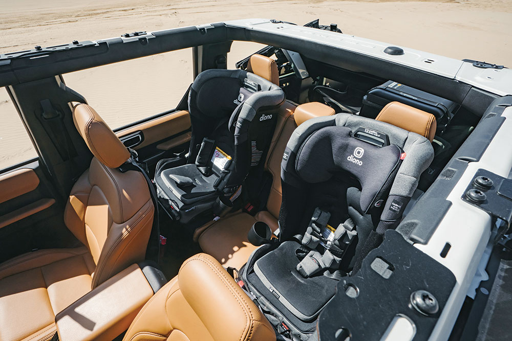 leather interiors with two black car seats in the back