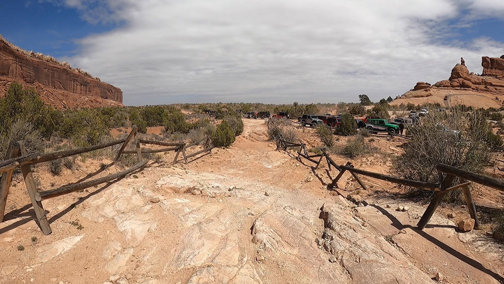 In this before and after, the improvement to the fence line and trail is seen.