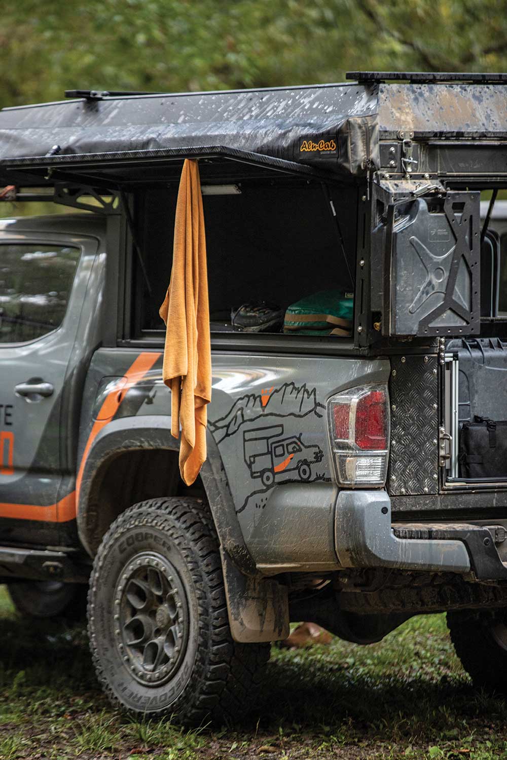 Toyota Tacoma with an open side wing panel shows the gear and spot where things can be hung up 