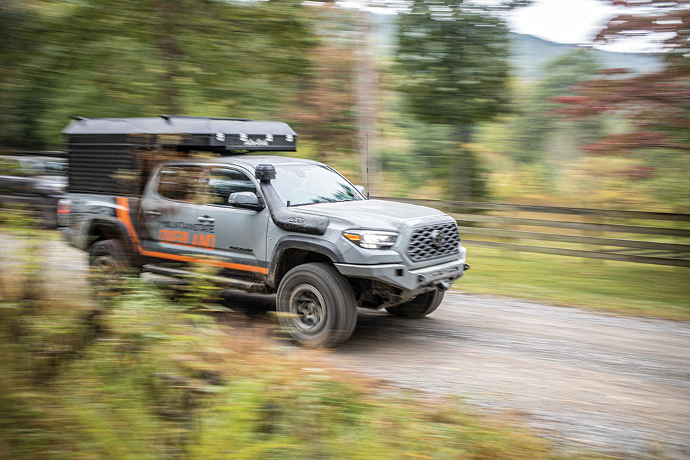 Mountain State Overland Toyota Tacoma rushes down the road quickly 
