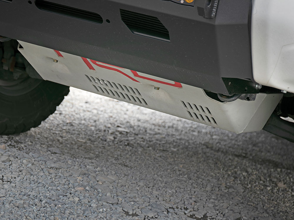 The underbelly of this vehicle features a gray skid plate with TRD logo in red.