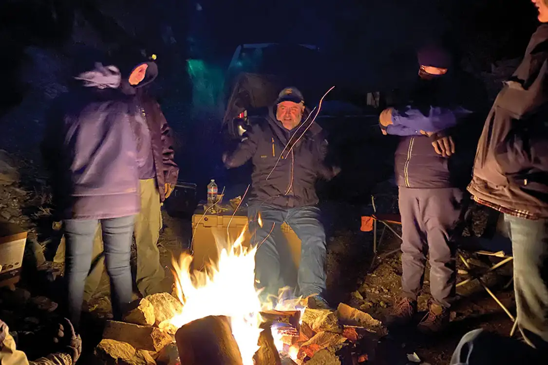 Everyone huddled close to the fire