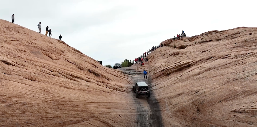 Jeep drives up Hell's Gate on Hell's Revenge in Moab, Utah.