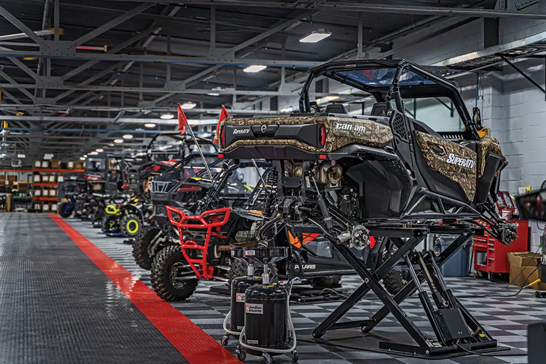 ATVs and UTVs fill the shop floor at one of SuperATV’s Indiana locations