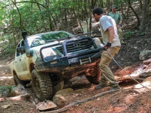 OEX trainer Ted Dinwiddie looks on as a student sets up to run a winch line