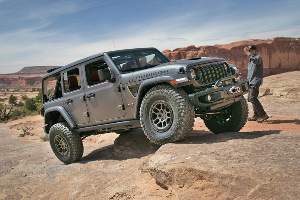 A lift kit gives the gray Jeep Rubicon the power to climb over rocks, as seen here.