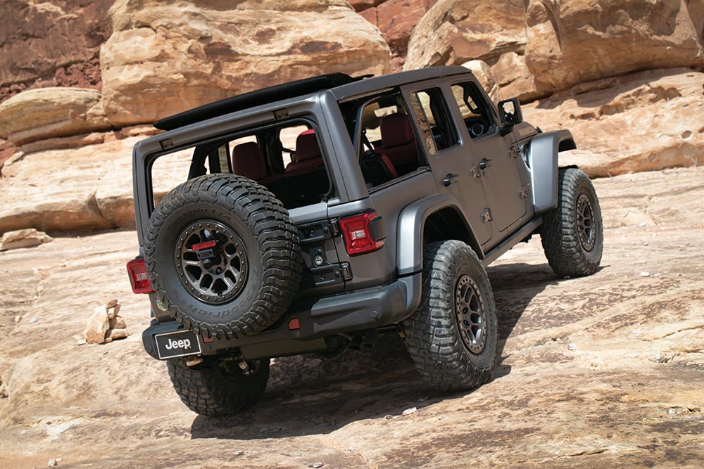The Jeep Rubicon concept looks like a normal Jeep from the outside as it climbs up a rocky hill.