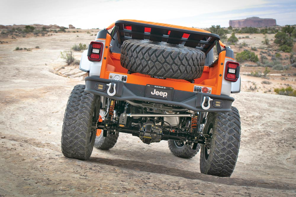 The rear view of the Jeep Bob concept shows its one spare tire stored in the bed and its high-clearance bumper.