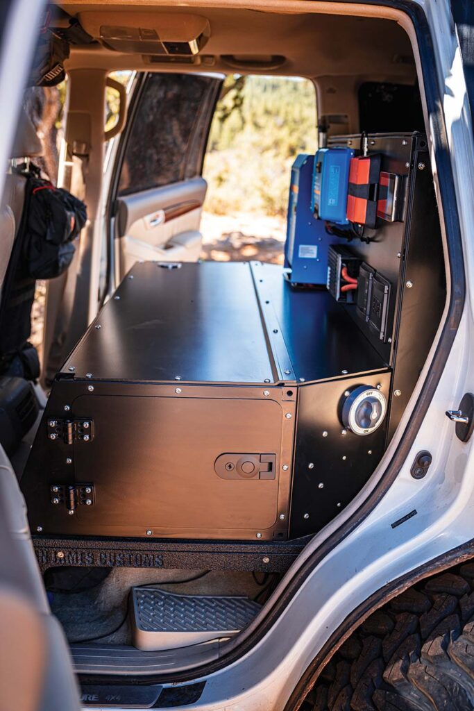 In place of rear seats, the GX470 has a large black storage box and custom water tank.