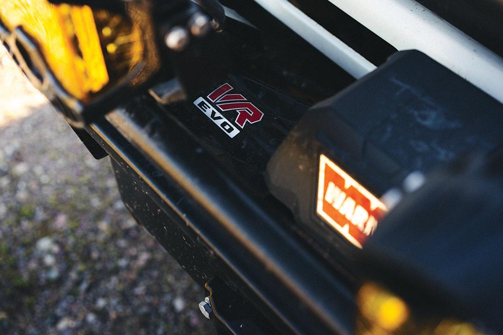 A close up of the WARN winch on the front bumper of the world traveling Troopy.