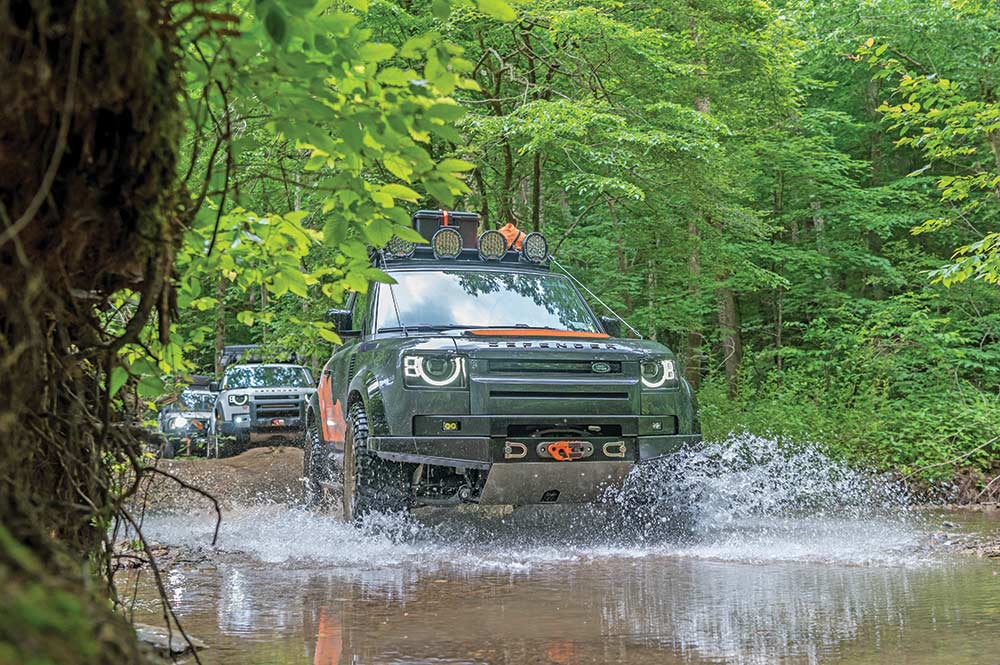Land Rover drives through standing water