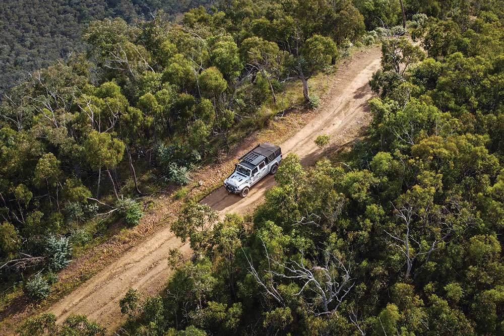 Jeep Gladiator driving a dirt road