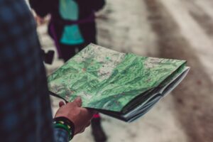 Someone holds a map while overlanding.
