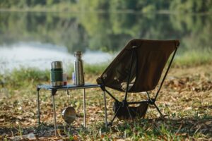 A camp chair and reusable water bottles make for great eco-friendly camp gear.