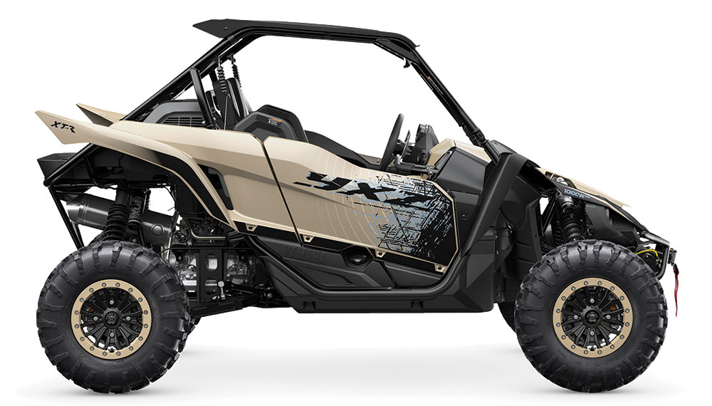 The sand and black Yamaha UTV.