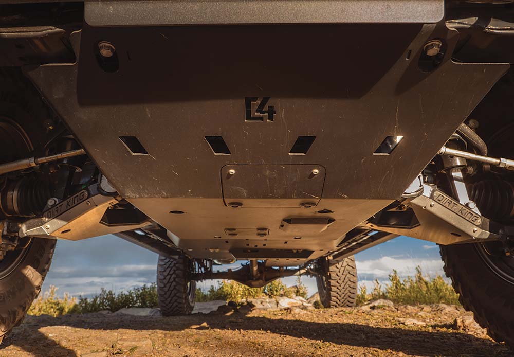 Looking under the truck reveals full body skid plates from front to rear.