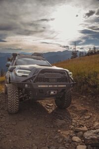 Under cloud cover, the HerschX Tacoma rolls uphill.