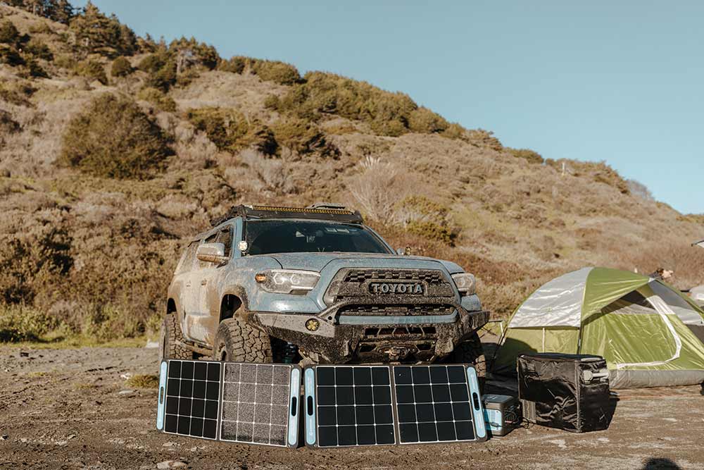 Toyota Truck with solar panels and tent set up