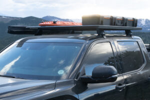 Rhino Rack Pioneer Platform with Maxtrax and storage box atop a black F150.