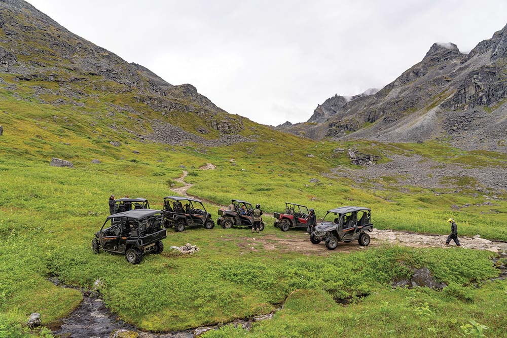 Vehicles circled up in Alaska wilderness