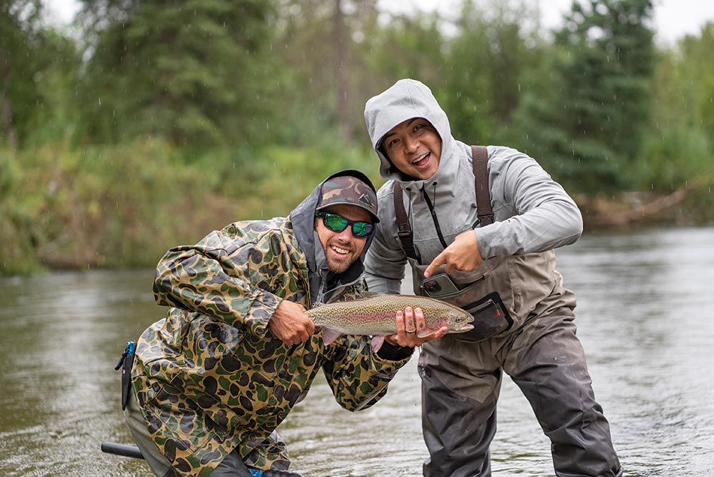 Two men with a fish they caught