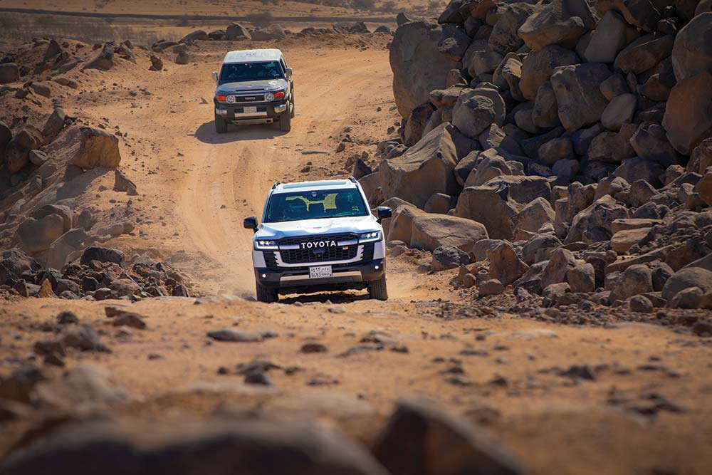 Two cars driving the Rally Jameel. 