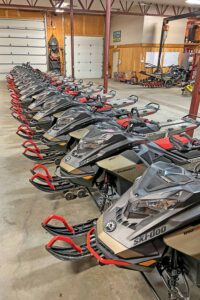 A line of the lastest versions of Ski-Doos await potential riders.
