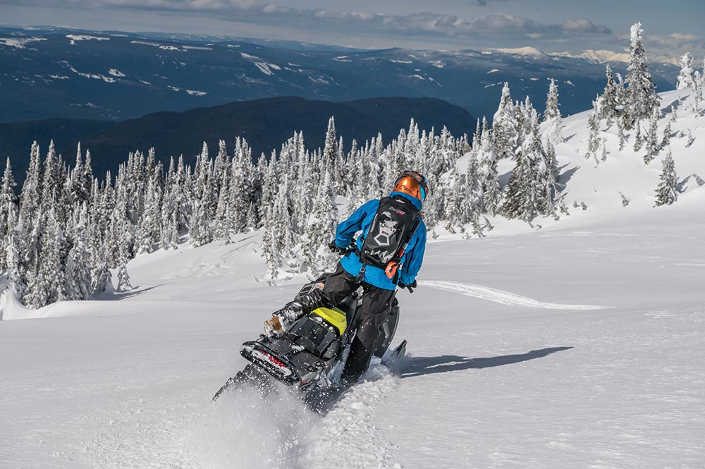 Rider takes a Ski-doo on the mountain