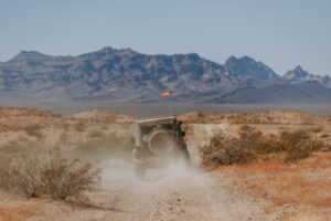 A jeep off-roads in the desert.