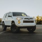 White 4Runner with headllights and fog lights on