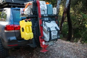 Gear stacked on the overland rack on the rear bumper of a 4x4.