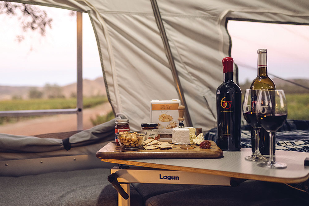 wine and cheese board inside of a tent