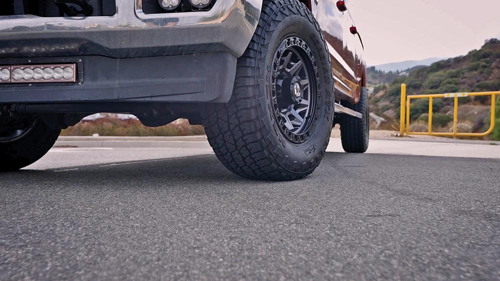 From the ground up, looking at the tire and front driver's side grille.