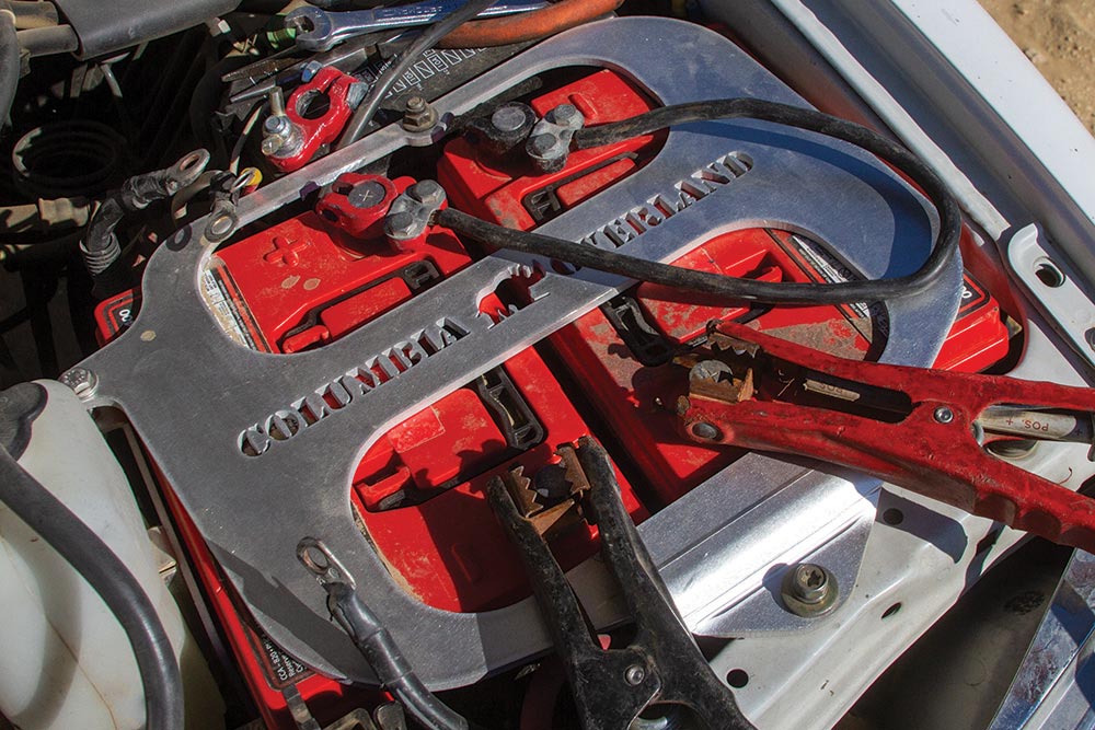 A red and black set of alligator clips attach to a red battery.