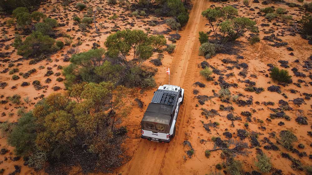 Jeep on Goog's Track on red sand 