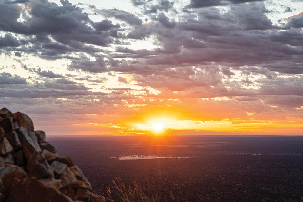 Sunrise from the top of Mt. Finke stretches to the endless horizon.
