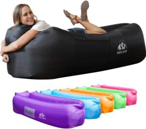 Woman smiling while laying on inflatable air hammock gifts for kids 