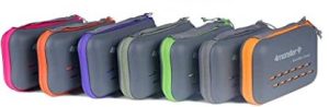 Seven small gray cases with colorful towels lined up together.