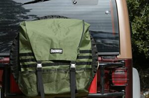A square green bag is strapped to the rear tire of a red Jeep.
