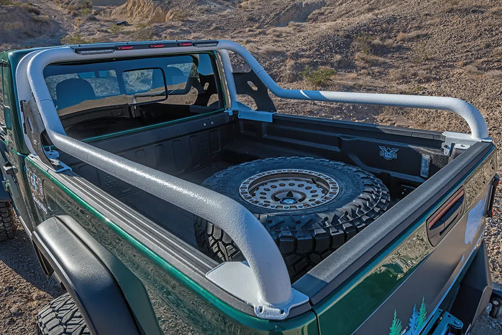 A full-size spare is mounted in the truck bed.